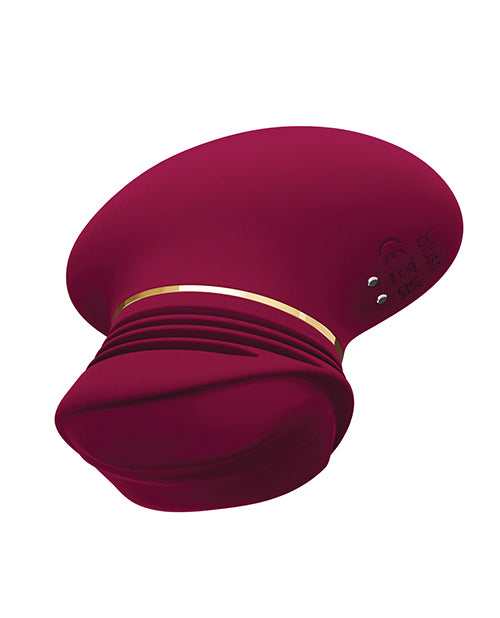 Mulberry Wine Riana palm-sized clitoral pleasure toy with textured ridges