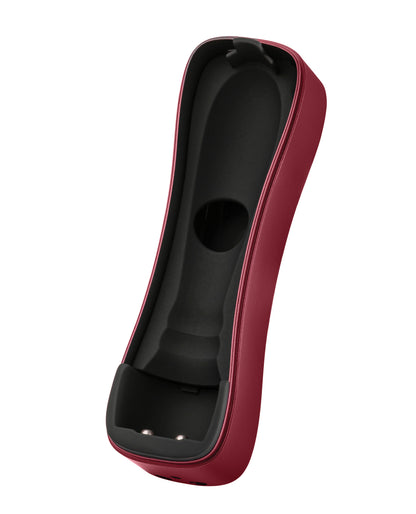 Hand holding the FemmeFunn Booster Bullet maroon massager to show size
