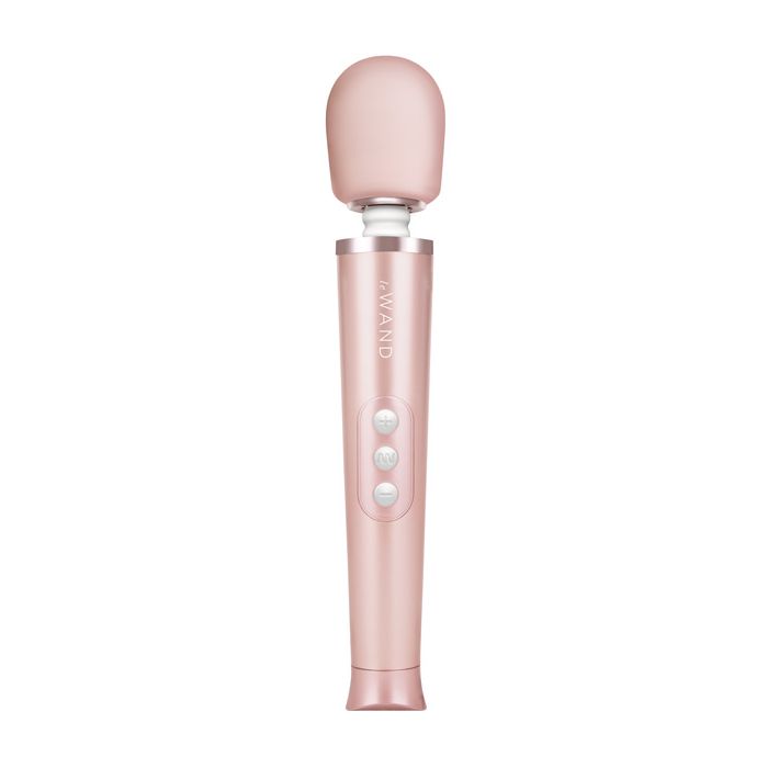 Hand holding the Le Wand Petite rose gold wand vibrator to show size and grip
