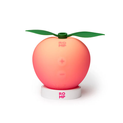 ROMP Pink Peach Pleasure Air Technology clitoral stimulator in pink peach — 14 intensities, IPX7 waterproof, rechargeable, body-safe silicone — comes with display stand
