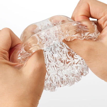 Reusable TENGA GEO Aqua sleeve with ergonomic grip and modern design.